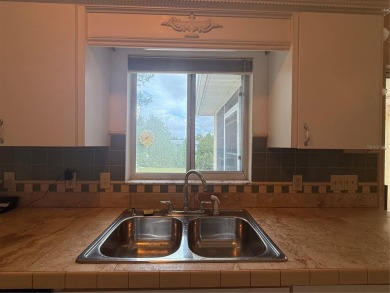 Spacious 2-bedroom, 3-bathroom home located in the active 55+ on Royal Oaks Golf Club in Florida - for sale on GolfHomes.com, golf home, golf lot