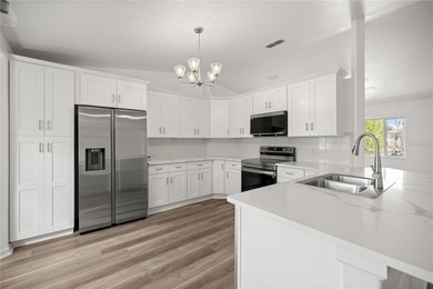 Welcome to this beautifully renovated three-bedroom on Royal Oaks Golf Club in Florida - for sale on GolfHomes.com, golf home, golf lot