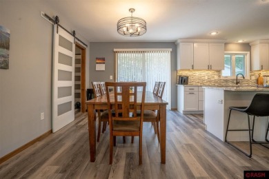 Step into this inviting 3-bedroom, 3-bathroom home where on New Ulm Country Club in Minnesota - for sale on GolfHomes.com, golf home, golf lot