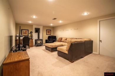 Step into this inviting 3-bedroom, 3-bathroom home where on New Ulm Country Club in Minnesota - for sale on GolfHomes.com, golf home, golf lot
