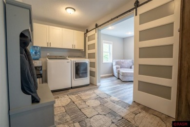 Step into this inviting 3-bedroom, 3-bathroom home where on New Ulm Country Club in Minnesota - for sale on GolfHomes.com, golf home, golf lot