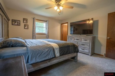 Step into this inviting 3-bedroom, 3-bathroom home where on New Ulm Country Club in Minnesota - for sale on GolfHomes.com, golf home, golf lot