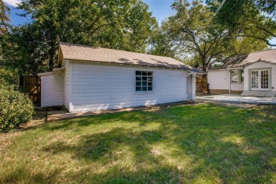 Step into this charming brick cottage and you'll be greeted by on Stevens Park Golf Course in Texas - for sale on GolfHomes.com, golf home, golf lot