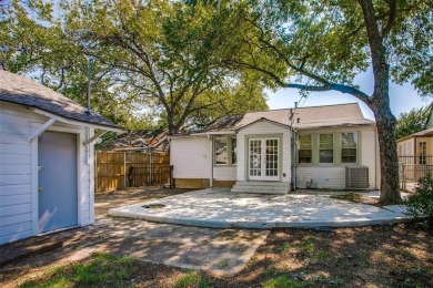 Step into this charming brick cottage and you'll be greeted by on Stevens Park Golf Course in Texas - for sale on GolfHomes.com, golf home, golf lot