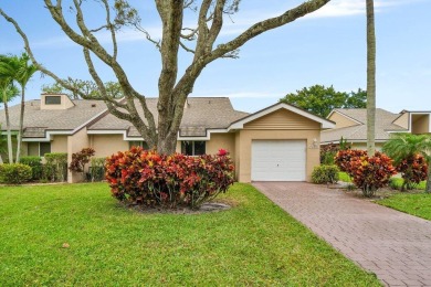 Discover the charm of this well-designed 3-bedroom, 2.5-bathroom on Fountains Golf and Country Club in Florida - for sale on GolfHomes.com, golf home, golf lot