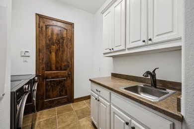 Stunning former model home perfectly positioned on the 13th hole on Lantana Golf Club in Texas - for sale on GolfHomes.com, golf home, golf lot
