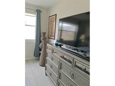 Beautifully remodeled, move-in-ready, two-bedroom, two-bathroom on Sunrise Lakes Phase IV Golf Course in Florida - for sale on GolfHomes.com, golf home, golf lot