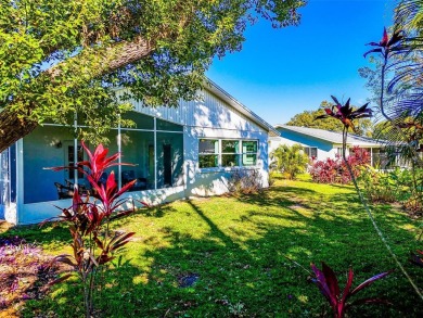 Welcome to a Retreat in Charm at 122 Stafford Dr., Palm Harbor on Highland Lakes Executive Golf Course in Florida - for sale on GolfHomes.com, golf home, golf lot