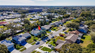 Welcome to a Retreat in Charm at 122 Stafford Dr., Palm Harbor on Highland Lakes Executive Golf Course in Florida - for sale on GolfHomes.com, golf home, golf lot