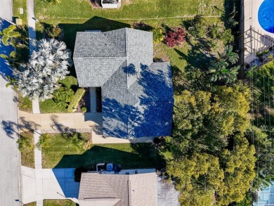 Welcome to a Retreat in Charm at 122 Stafford Dr., Palm Harbor on Highland Lakes Executive Golf Course in Florida - for sale on GolfHomes.com, golf home, golf lot