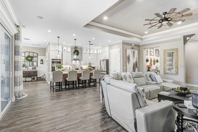 LIVE exceptionally in this 2022 custom-upgraded waterfront on Southern Hills Plantation Club in Florida - for sale on GolfHomes.com, golf home, golf lot