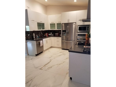 One story, single family, completely remodeled, 3 bedroom 2 on Jim McLean Signature Course in Florida - for sale on GolfHomes.com, golf home, golf lot
