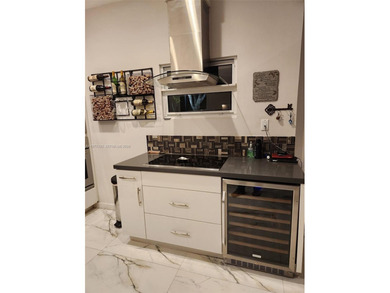 One story, single family, completely remodeled, 3 bedroom 2 on Jim McLean Signature Course in Florida - for sale on GolfHomes.com, golf home, golf lot