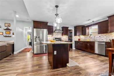 Welcome to your dream full-time residence in the heart of Four on Tan-Tar-A Golf Club in Missouri - for sale on GolfHomes.com, golf home, golf lot