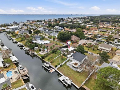 Deep water canal-front home in Gulf Breeze! Boating enthusiasts on Tiger Point Golf and Country Club in Florida - for sale on GolfHomes.com, golf home, golf lot