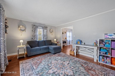 Welcome home! This spacious 4-bedroom 2.5 bathroom beauty is on Jacksonville Country Club in North Carolina - for sale on GolfHomes.com, golf home, golf lot