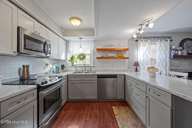 Welcome home! This spacious 4-bedroom 2.5 bathroom beauty is on Jacksonville Country Club in North Carolina - for sale on GolfHomes.com, golf home, golf lot