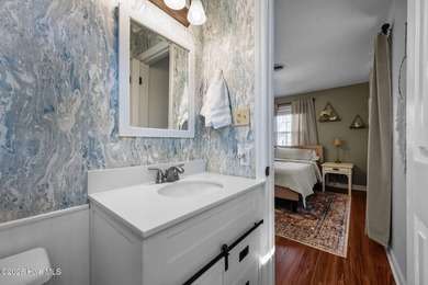 Welcome home! This spacious 4-bedroom 2.5 bathroom beauty is on Jacksonville Country Club in North Carolina - for sale on GolfHomes.com, golf home, golf lot