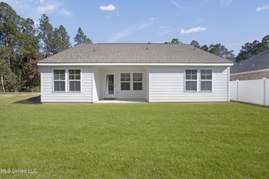 Looks like new! But this precious cottage in a quiet area of on Diamondhead Country Club in Mississippi - for sale on GolfHomes.com, golf home, golf lot