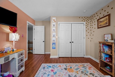 Welcome home! This spacious 4-bedroom 2.5 bathroom beauty is on Jacksonville Country Club in North Carolina - for sale on GolfHomes.com, golf home, golf lot