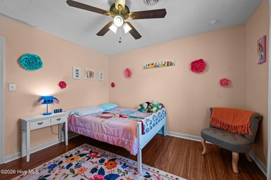 Welcome home! This spacious 4-bedroom 2.5 bathroom beauty is on Jacksonville Country Club in North Carolina - for sale on GolfHomes.com, golf home, golf lot