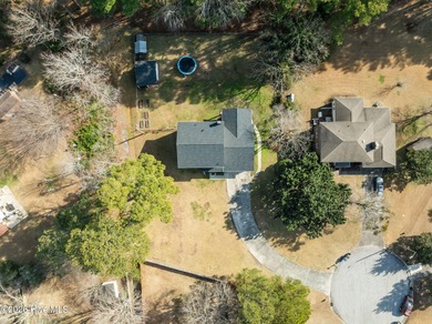 Welcome home! This spacious 4-bedroom 2.5 bathroom beauty is on Jacksonville Country Club in North Carolina - for sale on GolfHomes.com, golf home, golf lot