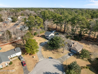 Welcome home! This spacious 4-bedroom 2.5 bathroom beauty is on Jacksonville Country Club in North Carolina - for sale on GolfHomes.com, golf home, golf lot