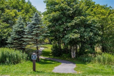 Enjoy LONG RANGE VIEWS from this VERY AFFORDABLE turnkey unit on Beech Mountain Club in North Carolina - for sale on GolfHomes.com, golf home, golf lot