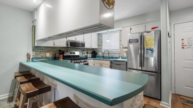 Resort-Style Townhouse with Ensuite Bedrooms, Sunroom & Prime on Edgewater Beach Resort in Florida - for sale on GolfHomes.com, golf home, golf lot