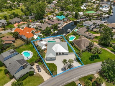 Canal-front home in Bay Point gated community. Gulf Access on Bay Point Resort Golf Club in Florida - for sale on GolfHomes.com, golf home, golf lot