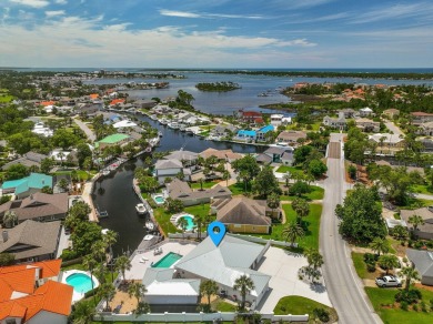Canal-front home in Bay Point gated community. Gulf Access on Bay Point Resort Golf Club in Florida - for sale on GolfHomes.com, golf home, golf lot