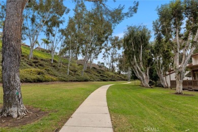 Welcome to 26562 Guadiana, a charming end-unit townhome nestled on Mission Viejo Country Club in California - for sale on GolfHomes.com, golf home, golf lot