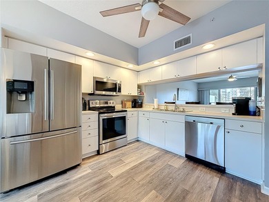 Country Club Condo at East Bay - Discover elevated, carefree on East Bay Golf Club in Florida - for sale on GolfHomes.com, golf home, golf lot