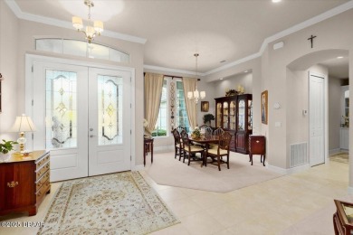 Step into elegance with this meticulously maintained residence on Plantation Bay Golf and Country Club in Florida - for sale on GolfHomes.com, golf home, golf lot