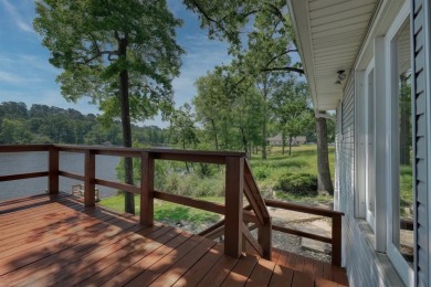 Welcome to a tranquil waterfront retreat nestled in the trees in on Hide-A-Way Lake Golf Course in Texas - for sale on GolfHomes.com, golf home, golf lot