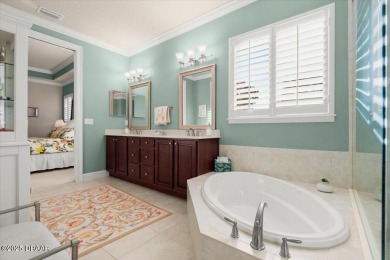 Step into elegance with this meticulously maintained residence on Plantation Bay Golf and Country Club in Florida - for sale on GolfHomes.com, golf home, golf lot