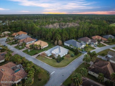 Step into elegance with this meticulously maintained residence on Plantation Bay Golf and Country Club in Florida - for sale on GolfHomes.com, golf home, golf lot