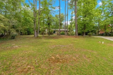 Discover this charming 3-bedroom, 2-bath ranch-style home on Fairfield Plantation Golf and Country Club in Georgia - for sale on GolfHomes.com, golf home, golf lot