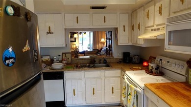 Welcome home to paradise in this fabulous main-level condo on Royal Palm Golf Club in Florida - for sale on GolfHomes.com, golf home, golf lot