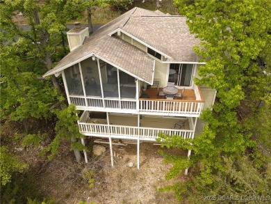Welcome to your dream retreat in Tan Tar A Estates, an exclusive on The Oaks Golf Course in Missouri - for sale on GolfHomes.com, golf home, golf lot