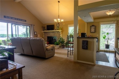 Welcome to your dream retreat in Tan Tar A Estates, an exclusive on The Oaks Golf Course in Missouri - for sale on GolfHomes.com, golf home, golf lot