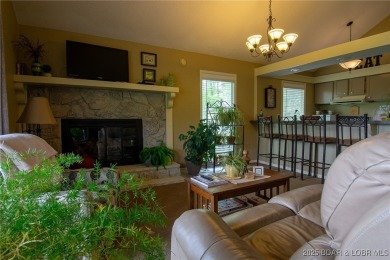 Welcome to your dream retreat in Tan Tar A Estates, an exclusive on The Oaks Golf Course in Missouri - for sale on GolfHomes.com, golf home, golf lot