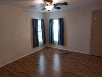 Lot Rent is $1,185.00 monthly. This is a 2-bedroom 2 bath on Lake Fairways Country Club in Florida - for sale on GolfHomes.com, golf home, golf lot