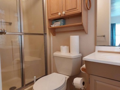 Lot Rent is $1,185.00 monthly. This is a 2-bedroom 2 bath on Lake Fairways Country Club in Florida - for sale on GolfHomes.com, golf home, golf lot