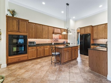 IMPROVED PRICE--An iconic palm tree and elegant paver driveway on Harbor Hills Country Club in Florida - for sale on GolfHomes.com, golf home, golf lot