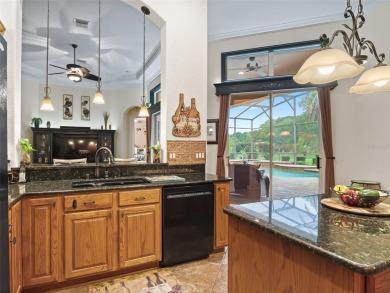 IMPROVED PRICE--An iconic palm tree and elegant paver driveway on Harbor Hills Country Club in Florida - for sale on GolfHomes.com, golf home, golf lot