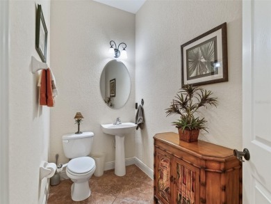 IMPROVED PRICE--An iconic palm tree and elegant paver driveway on Harbor Hills Country Club in Florida - for sale on GolfHomes.com, golf home, golf lot