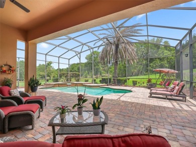IMPROVED PRICE--An iconic palm tree and elegant paver driveway on Harbor Hills Country Club in Florida - for sale on GolfHomes.com, golf home, golf lot