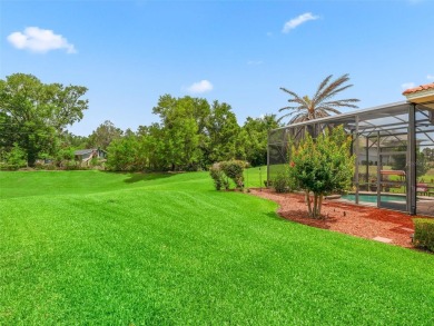 IMPROVED PRICE--An iconic palm tree and elegant paver driveway on Harbor Hills Country Club in Florida - for sale on GolfHomes.com, golf home, golf lot