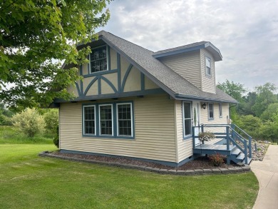 Nestled on two spacious lots totaling 0.79 acres with just one on Sugar Springs Country Club in Michigan - for sale on GolfHomes.com, golf home, golf lot